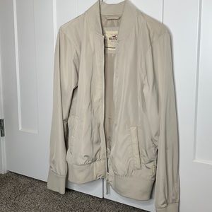 Cream bomber jacket with ribbed sleeves and hem